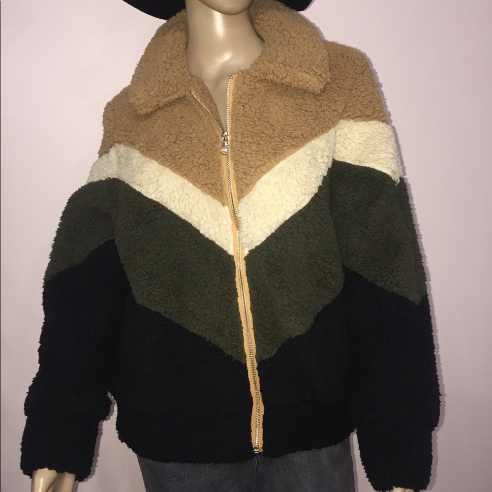 She sky black, green, brown jacket